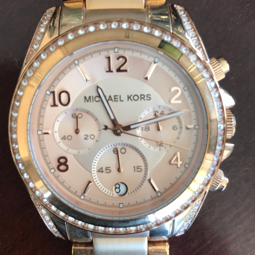 Michael Kors plated steel gold color.